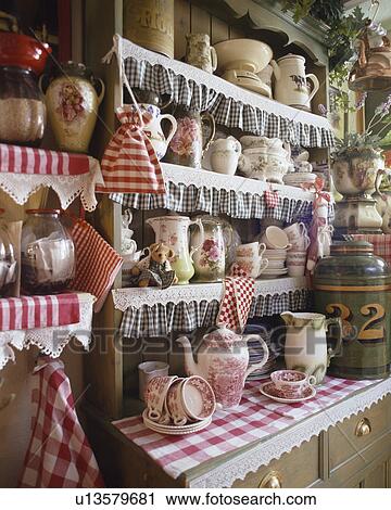 Close-up of green dresser trimmed with red and blue checked fabric View Large Photo Image Stock Image - Close-up of green dresser trimmed with red and blue checked fabric. Fotosearch