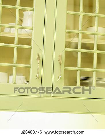 Close-up of green kitchen unit with glazed doors View Large Photo Image Stock Photograph - Close-up of green kitchen unit with glazed doors. Fotosearch