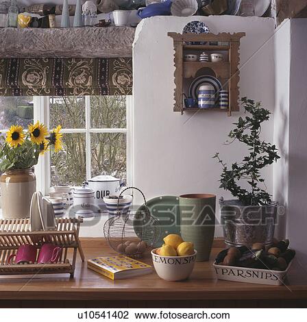 Close-up of green pots and wooden rack on kitchen worktop View Large Photo Image Stock Image - Close-up of green pots and wooden rack on kitchen worktop. Fotosearch