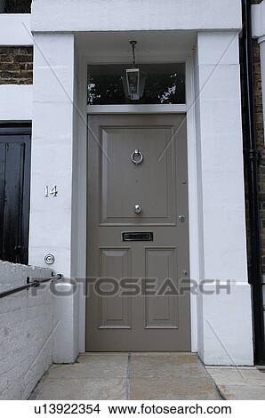 Picture - Close-up of grey front door of traditional Victorian house. Fotosearch