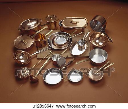Close-up of group of copper and stainless-steel saucepans and frying pans and fish-kettle View Large Photo Image Stock Photo - Close-up of group of copper and stainless-steel saucepans and frying pans and fish-kettle. Fotosearch