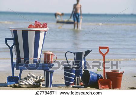 Close-up of hand-painted blue+white striped tin buckets and jugs on the seashore View Large Photo Image Stock Image - Close-up of hand-painted blue+white striped tin buckets and jugs on the seashore. Fotosearch