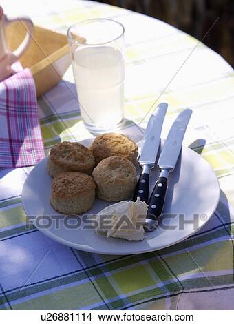 Close-up of home-made scones and Cornish cream on white plate View Large Photo Image Picture - Close-up of home-made scones and Cornish cream on white plate . Fotosearch
