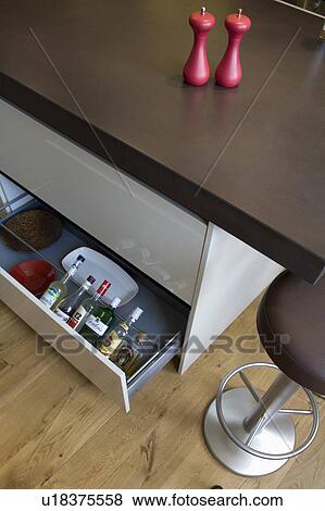 Close-up of island unit with bottles in open storage drawer View Large Photo Image Stock Photo - Close-up of island unit with bottles in open storage drawer. Fotosearch