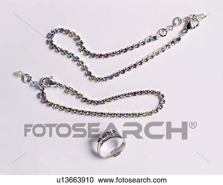 Close-up of jewelled silver ring and jewelled necklaces View Large Photo Image Stock Image - Close-up of jewelled silver ring and jewelled necklaces. Fotosearch