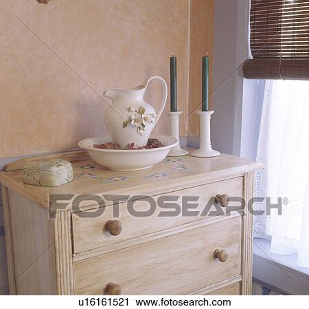 Close-up of jug and bowl on distressed effect chest-of-drawers View Large Photo Image Stock Image - Close-up of jug and bowl on distressed effect chest-of-drawers. Fotosearch
