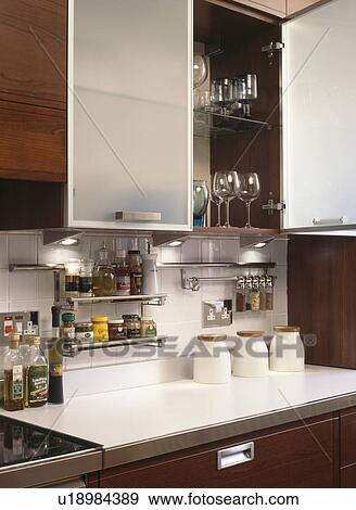 Close-up of kitchen cupboard with opaque glazed doors View Large Photo Image Stock Photo - Close-up of kitchen cupboard with opaque glazed doors. Fotosearch