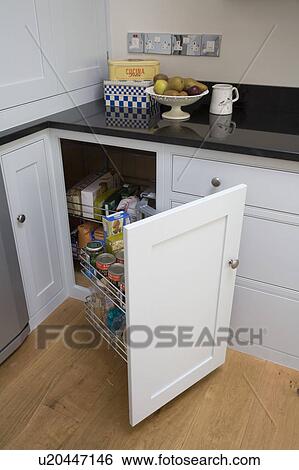Close Up Of Kitchen Unit With Angled Pull Out Storage Drawers