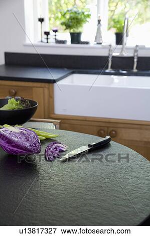Close-up of knife and sliced vegetables on granite worktop View Large Photo Image Stock Photo - Close-up of knife and sliced vegetables on granite worktop. Fotosearch