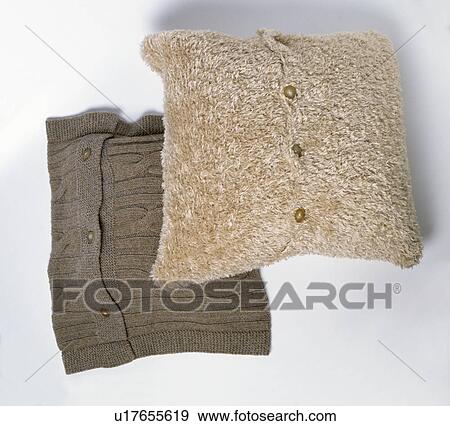 Close-up of knitted brown cushion and beige faux-fur cushion View Large Photo Image Stock Photo - Close-up of knitted brown cushion and beige faux-fur cushion. Fotosearch