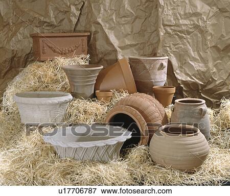 Close-up of large empty terracotta and stone garden pots on straw View Large Photo Image Stock Photo - Close-up of large empty terracotta and stone garden pots on straw. Fotosearch
