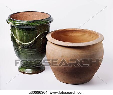 Picture - Close-up of large green glazed and terracotta garden pots. Fotosearch