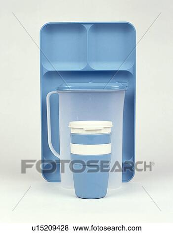 Stock Photo - Close-up of lidded plastic pots with plastic jug and blue plastic tray. Fotosearch