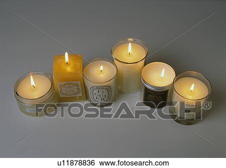 Close-up of lighted candles in glass candle-holders View Large Photo Image Stock Photograph - Close-up of lighted candles in glass candle-holders. Fotosearch