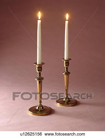 lighted candle sticks