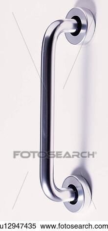 Stock Photography - Close-up of long stainless-steel door-handle. Fotosearch