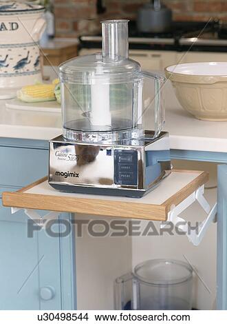 Close-up of Magimix food processor on pull-out shelf View Large Photo Image Picture - Close-up of Magimix food processor on pull-out shelf. Fotosearch