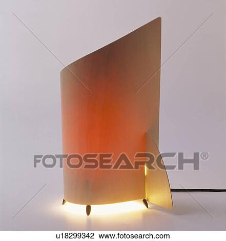 Close-up of modern curved wood lamp View Large Photo Image Stock Image - Close-up of modern curved wood lamp. Fotosearch