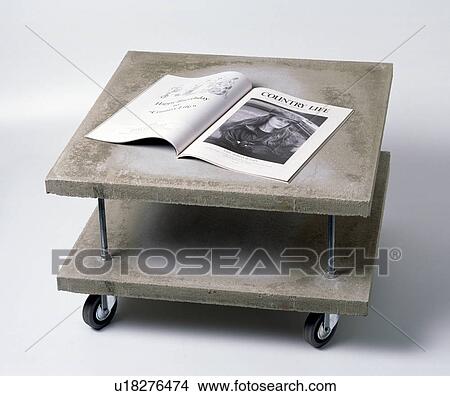 Close-up of modern double-tiered stone table on castors View Large Photo Image Picture - Close-up of modern double-tiered stone table on castors. Fotosearch