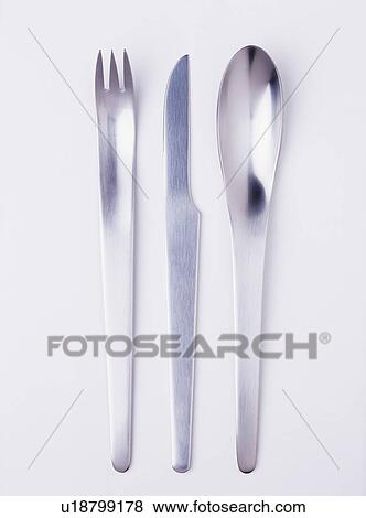 Close-up of modern stainless-steel knife and fork with spoon View Large Photo Image Stock Photo - Close-up of modern stainless-steel knife and fork with spoon. Fotosearch