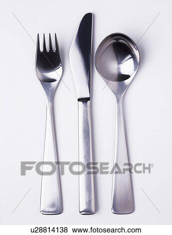 Close-up of modern stainless-steel knife and fork with spoon View Large Photo Image Stock Photo - Close-up of modern stainless-steel knife and fork with spoon. Fotosearch