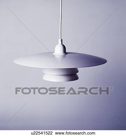 Stock Image - Close-up of modern white ceiling light. Fotosearch