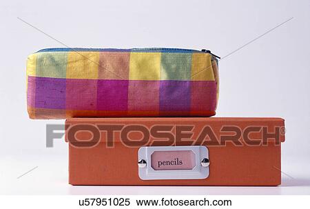 Close-up of multi-coloured checked fabric pencil case on top of small red pencil-storage box View Large Photo Image Stock Photography - Close-up of multi-coloured checked fabric pencil case on top of small red pencil-storage box. Fotosearch