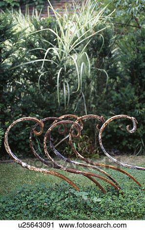 Close-up of novelty sculpture of metal curves View Large Photo Image Stock Image - Close-up of novelty sculpture of metal curves. Fotosearch