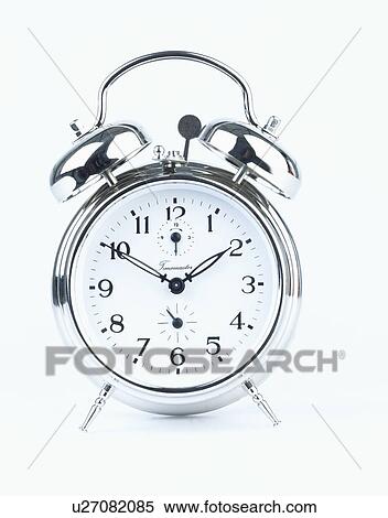 Stock Photography - Close-up of old-fashioned stainless-steel alarm clock. Fotosearch