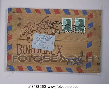 Stock Image - Close-up of old wooden French winebox with address label. Fotosearch