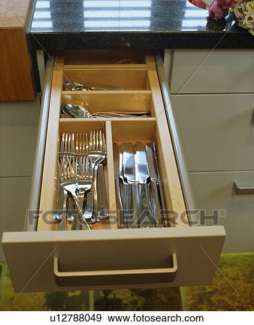 Close-up of open cutlery storage drawer View Large Photo Image Stock Photo - Close-up of open cutlery storage drawer. Fotosearch