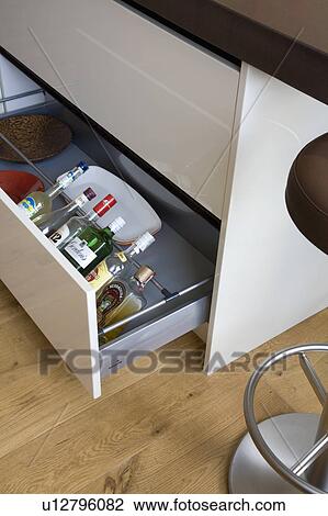 Close-up of open kitchen storage drawer with bottles View Large Photo Image Stock Image - Close-up of open kitchen storage drawer with bottles. Fotosearch