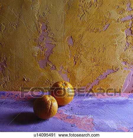 close-up of oranges on rough purple surface against textured yellow and mauve roughly plastered wall View Large Photo Image Stock Image - close-up of oranges on rough purple surface against textured yellow and mauve roughly plastered wall. Fotosearch