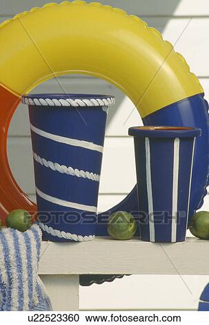 Close-up of painted blue+white pots against colourful yellow and blue plastic ring View Large Photo Image Stock Image - Close-up of painted blue+white pots against colourful yellow and blue plastic ring. Fotosearch