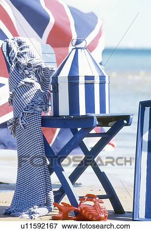 Close-up of painted blue+white striped pot on blue chair on beach View Large Photo Image Stock Photo - Close-up of painted blue+white striped pot on blue chair on beach. Fotosearch