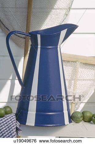 Close-up of painted blue+white striped enamel jug View Large Photo Image Stock Photograph - Close-up of painted blue+white striped enamel jug. Fotosearch