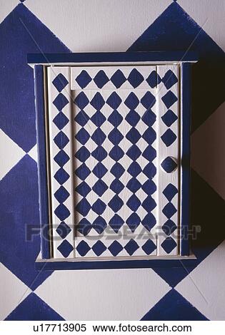 Close-up of painted chequerboard bathroom cupboard View Large Photo Image Stock Photography - Close-up of painted chequerboard bathroom cupboard. Fotosearch