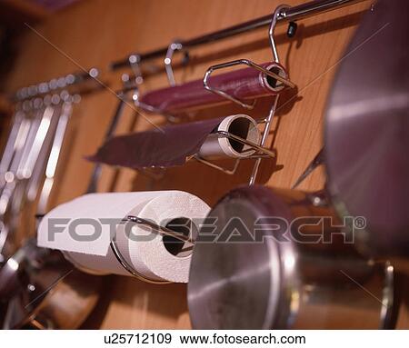 Stock Photo - Close-up of paper towel roll on metal storage rack&#10; &#10;. Fotosearch