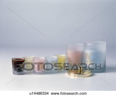 Close-up of pastel-coloured candles in glass votive jars View Large Photo Image Picture - Close-up of pastel-coloured candles in glass votive jars. Fotosearch
