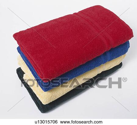 Close-up of pile of folded red and blue with cream and black towels View Large Photo Image Stock Photograph - Close-up of pile of folded red and blue with cream and black towels. Fotosearch