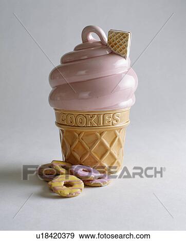 Close-up of pink and cream icecream-shaped biscuit jar View Large Photo Image Stock Photo - Close-up of pink and cream icecream-shaped biscuit jar. Fotosearch