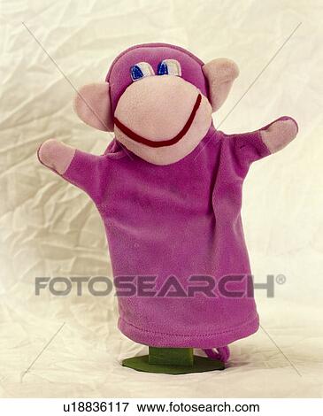 Stock Photo - Close-up of pink felt monkey hand-puppet. Fotosearch