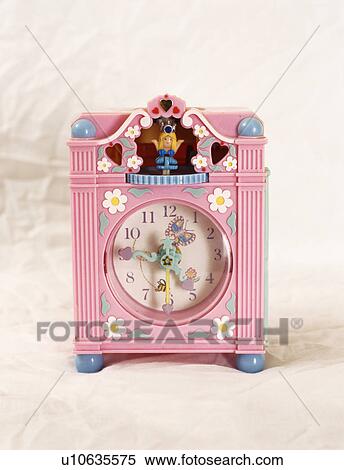 Stock Photography - Close-up of pink plastic child's clock. Fotosearch
