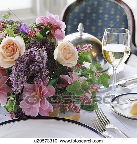 Close-up of pink roses and lilac in floral table decoration View Large Photo Image Stock Image - Close-up of pink roses and lilac in floral table decoration. Fotosearch