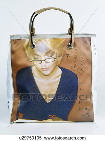 Close-up of plastic tote-bag printed with photograph of women's face View Large Photo Image Stock Photography - Close-up of plastic tote-bag printed with photograph of women's face. Fotosearch