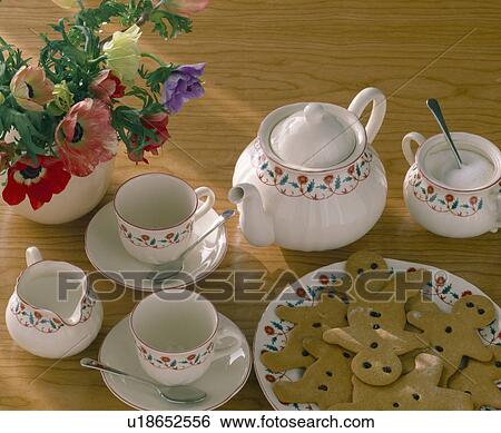 Close-up of plate of gingerbread men biscuits and teapot with matching cups and jugs View Large Photo Image Stock Photograph - Close-up of plate of gingerbread men biscuits and teapot with matching cups and jugs . Fotosearch