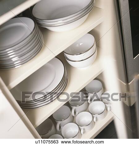 Close-up of platinum-edged white Rosenthal Thomas china on white shelves View Large Photo Image Stock Image - Close-up of platinum-edged white Rosenthal Thomas china on white shelves. Fotosearch