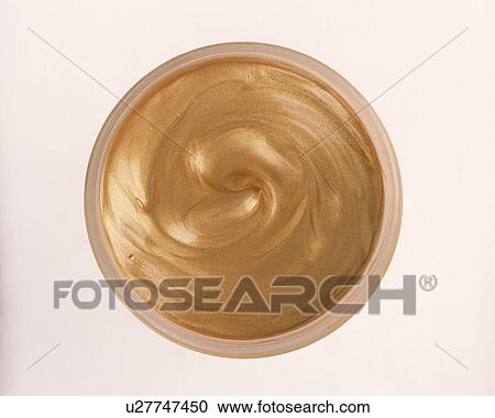Close-up of pot of gold metallic cream eyeshadow View Large Photo Image Stock Image - Close-up of pot of gold metallic cream eyeshadow. Fotosearch