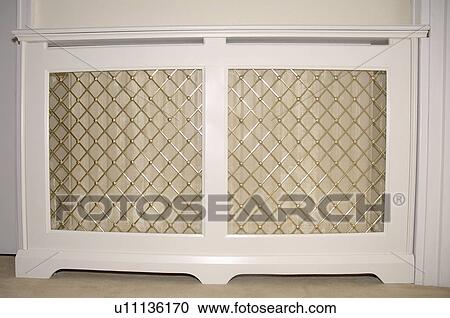 Close-up of radiator with traditional wood and fretwork cover View Large Photo Image Stock Image - Close-up of radiator with traditional wood and fretwork cover. Fotosearch