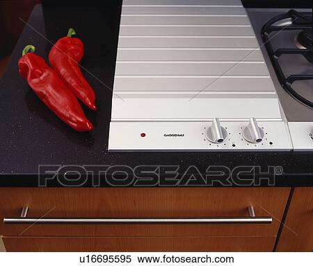 Close-up of red chilli peppers beside Gaggenau hob View Large Photo Image Stock Photography - Close-up of red chilli peppers beside Gaggenau hob. Fotosearch